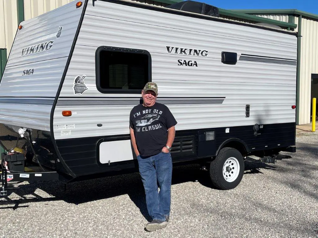 Man standing by Viking Saga camper