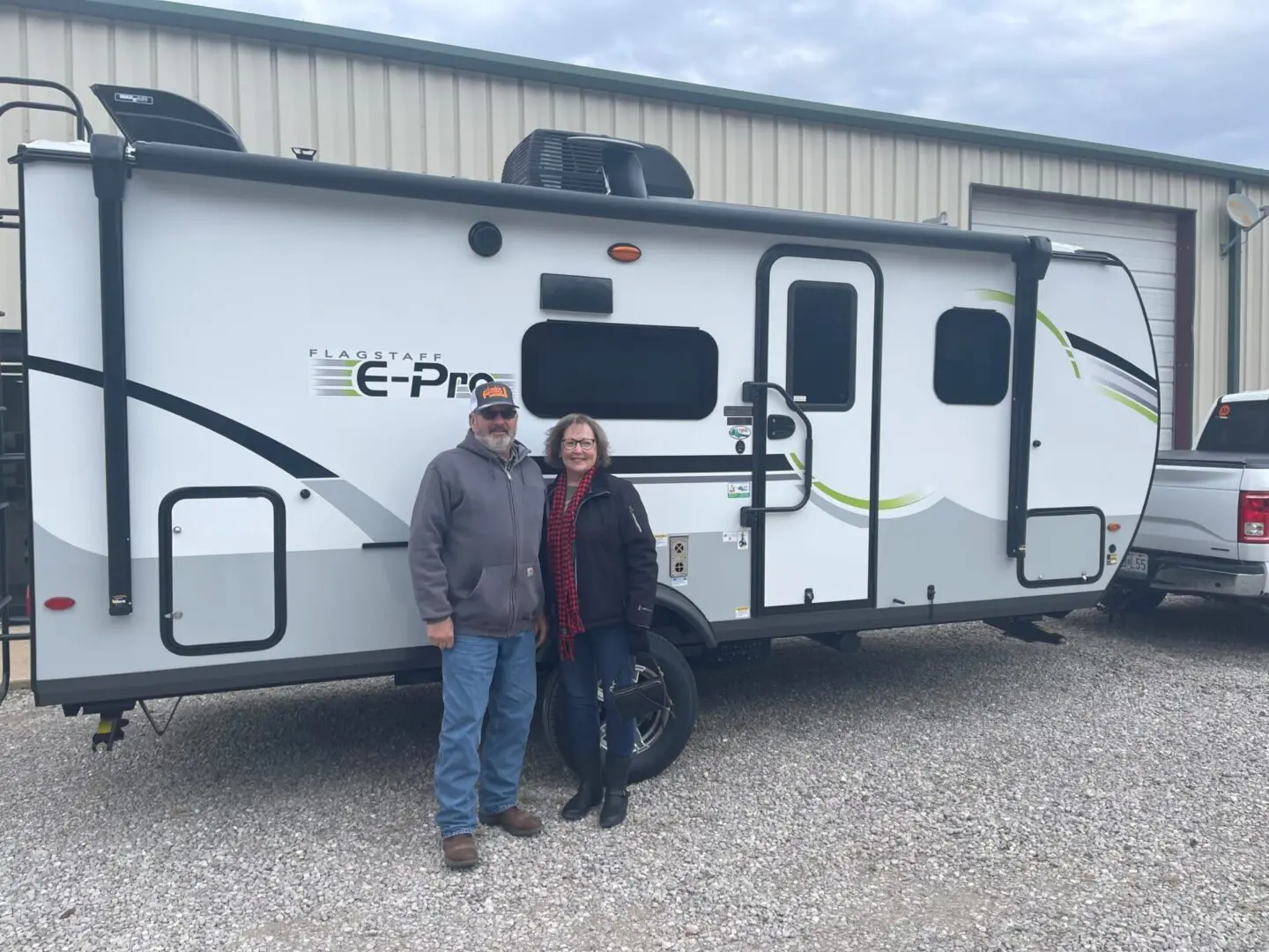 Smiling pair near their camper