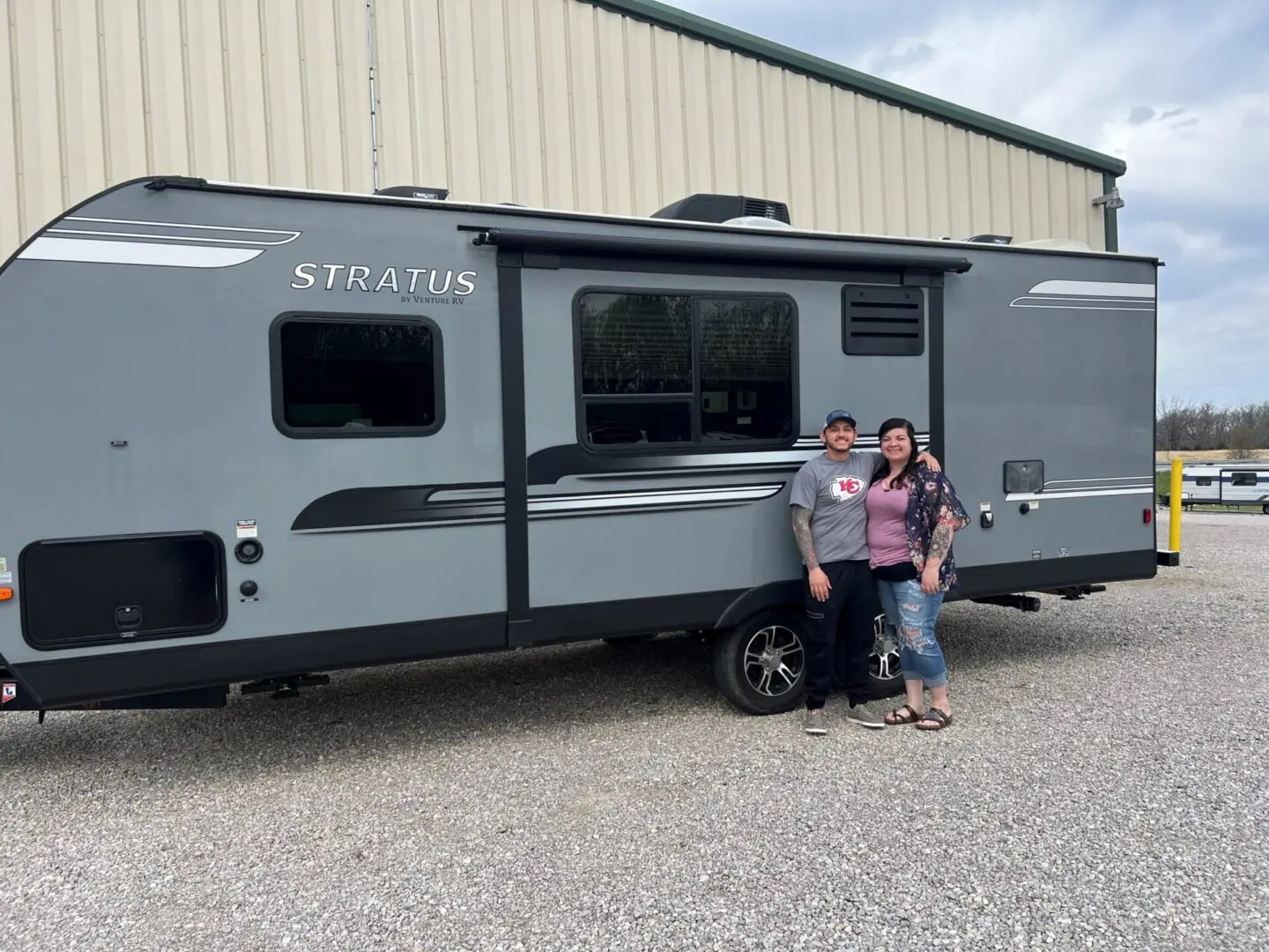 People posing with a Stratus camper